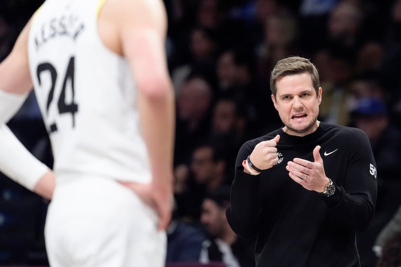 Utah Jazz coach Will Hardy talks to Walker Kessler during a game against the Brooklyn Nets, Jan. 29, 2024, in New York.