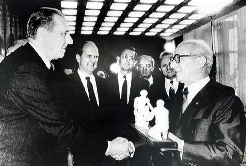 President Thomas S. Monson, left, presents a statue to Erich Honecker, chairman of State Council of the German Democratic Republic, as Elder Russell M. Nelson; Henry J. Burkhardt, president of the Freiberg Temple; Manfred Schutze, president of the Leipzig