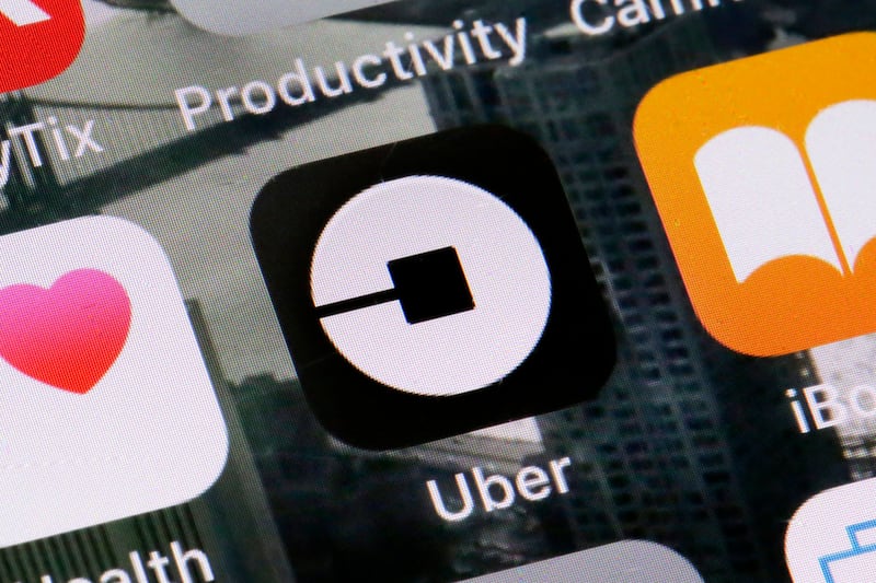 FILE - This Tuesday, June 12, 2018, file photo shows the Uber app on a phone in New York. Uber on Thursday, April 18, 2019, said that it is releasing a new feature to help riders ensure they’re getting into the right vehicles. The development comes severa