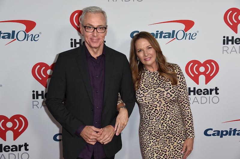 Dr. Drew Pinsky, left, and Susan Pinsky attend the 2019 iHeartRadio Podcast Awards at the iHeartRadio Theater on Friday, Jan.18, 2019, in Burbank, Calif.