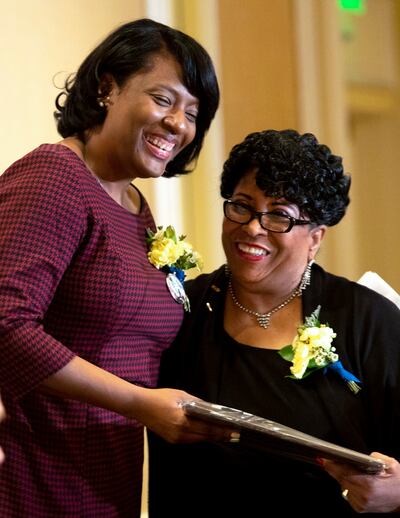 NAACP Salt Lake Branch President Jeanetta Williams, right, presents the Rosa Parks Award to Rep. Sandra Hollins, D-Salt Lake City, during the 35th annual Dr. Martin Luther King Jr. Memorial Luncheon at the Little America Hotel in Salt Lake City on Monday,