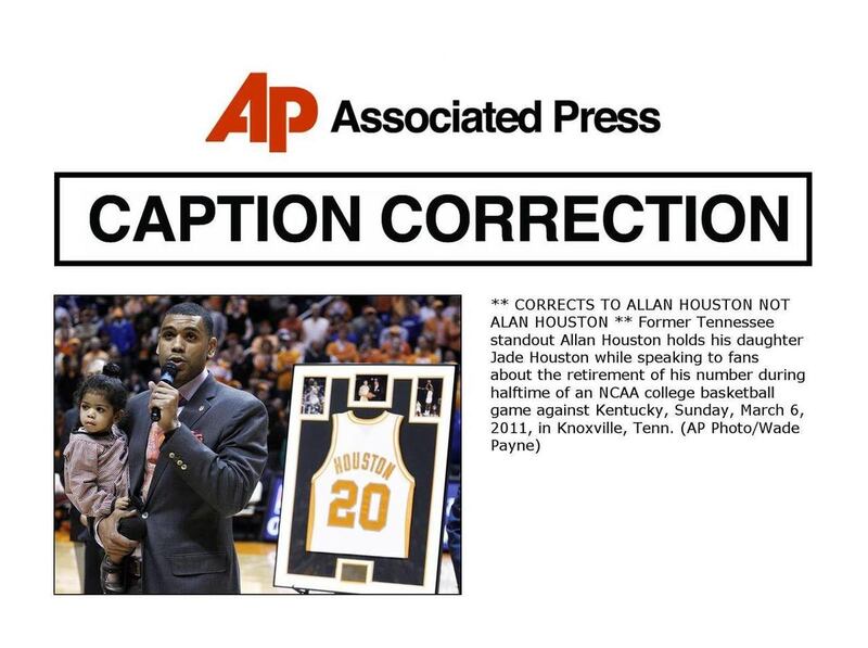 ** CORRECTS TO ALLAN HOUSTON NOT ALAN HOUSTON ** Former Tennessee standout Allan Houston holds his daughter Jade Houston while speaking to fans about the retirement of his number during halftime of an NCAA college basketball game against Kentucky, Sunday,