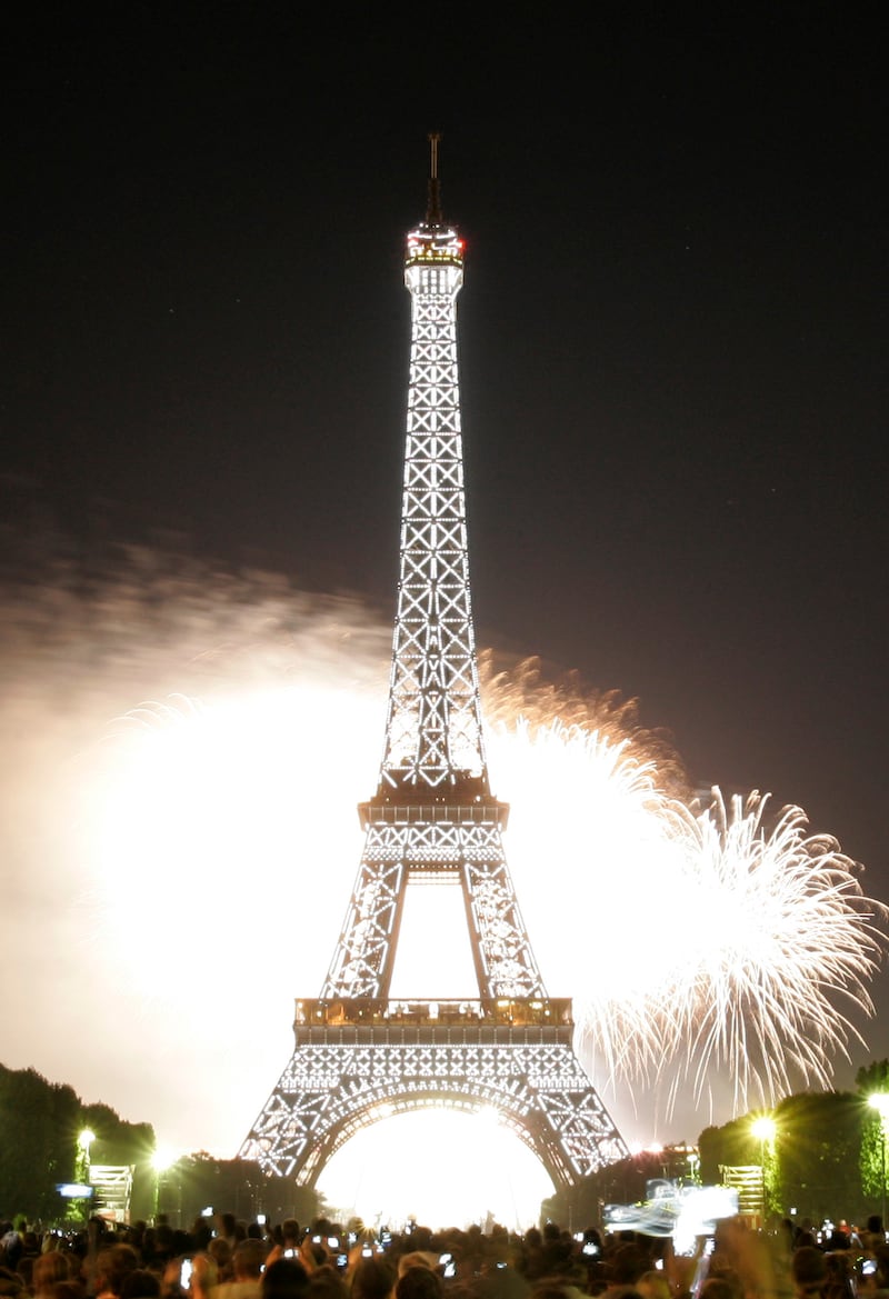 Fireworks illuminate the night sky at the Eiffel Tower in Paris during Bastille Day celebrations in this 2008 file photo. late Monday, July 14, 2008. (AP Photo/Thibault Camus)