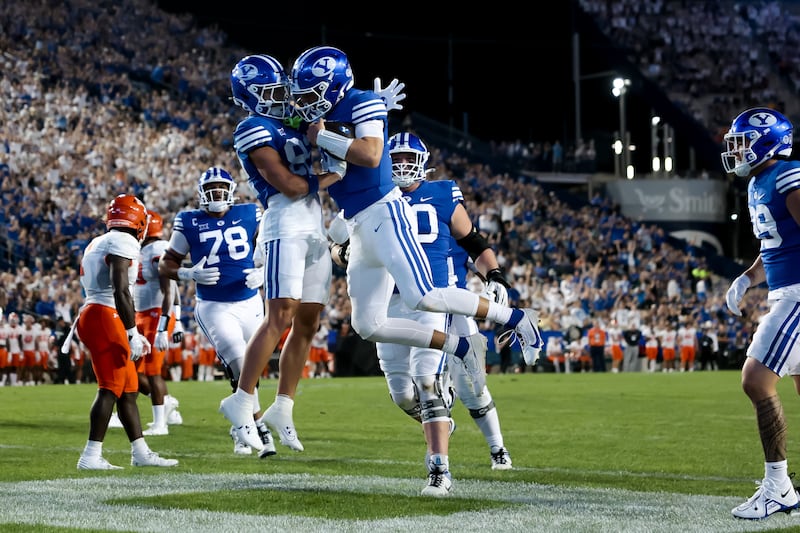 BYU Cougars wide receiver Parker Kingston (82) and quarterback Kedon Slovis (10) celebrate.