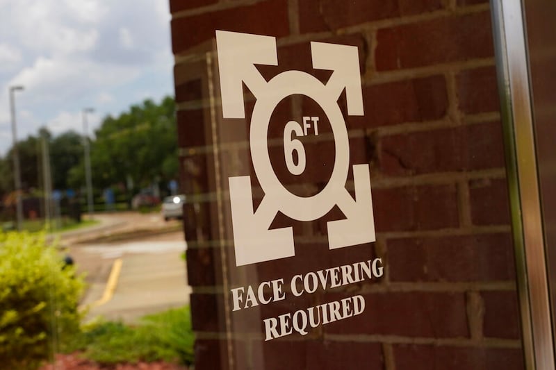 Face covering signage at the Rose E. McCoy Auditorium in Jackson, Miss.