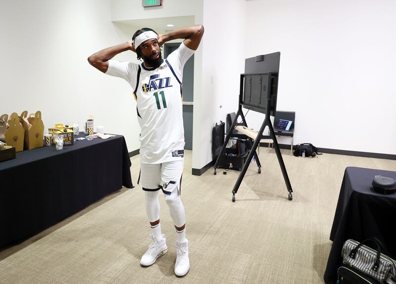 Utah Jazz guard Mike Conley has a short discussion with members of the media at Jazz media media day in Salt Lake City.