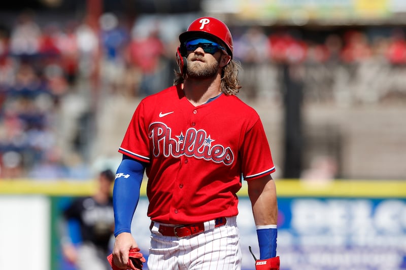 Philadelphia Phillies’ Bryce Harper steps off first during a spring training baseball game, Monday, March 9, 2020, in Clearwater, Fla.