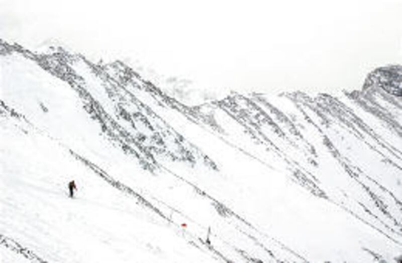 A lone skier traverses the Headwaters Bowl area at Moonlight Basin in Big Sky, Mont. Dwarfed by its neighbor, the Big Sky Resort, Moonlight still offers big-resort amenities.