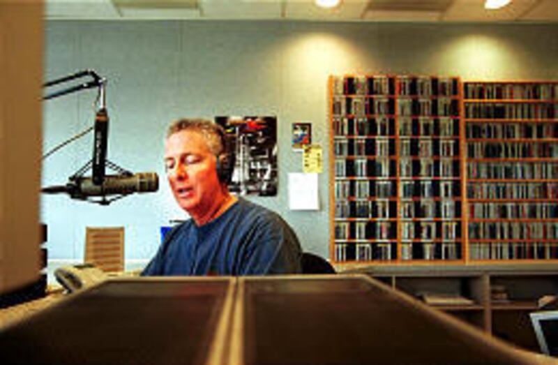 Dan Jessop does an on-air shift at KBZN. He has been a DJ for 36 years.<BR>