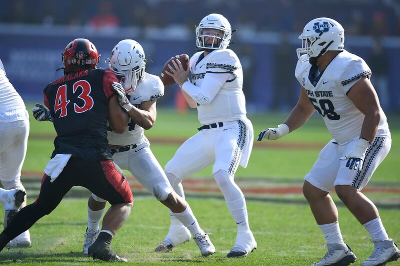 Utah State quarterback Logan Bonner drops back to pass against SDSU in the MWC championship game in Carson, Calif.