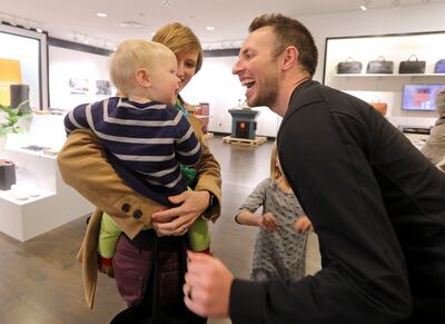 Curtis Calder says hi to his wife, Allison, and son Owen at his store, Anson Calder, at City Creek Center in Salt Lake City on Monday, Dec. 17, 2018.