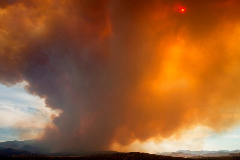 Smoke rises from the Telegraph Fire near Miami and Globe, Ariz.