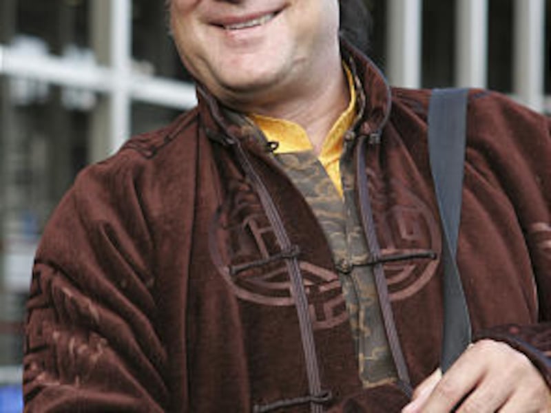 In this May 18, 2006, file photo actor Steven Seagal smiles on his arrival at Sheremetyevo airport in Moscow.