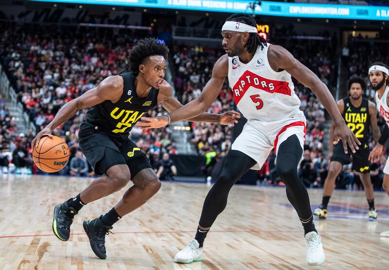 Utah Jazz’s Collin Sexton (2) tries to get past Toronto Raptors’ Precious Achiuwa (5) during first-half preseason NBA basketball game action in Edmonton, Alberta, Sunday, Oct. 2, 2022.