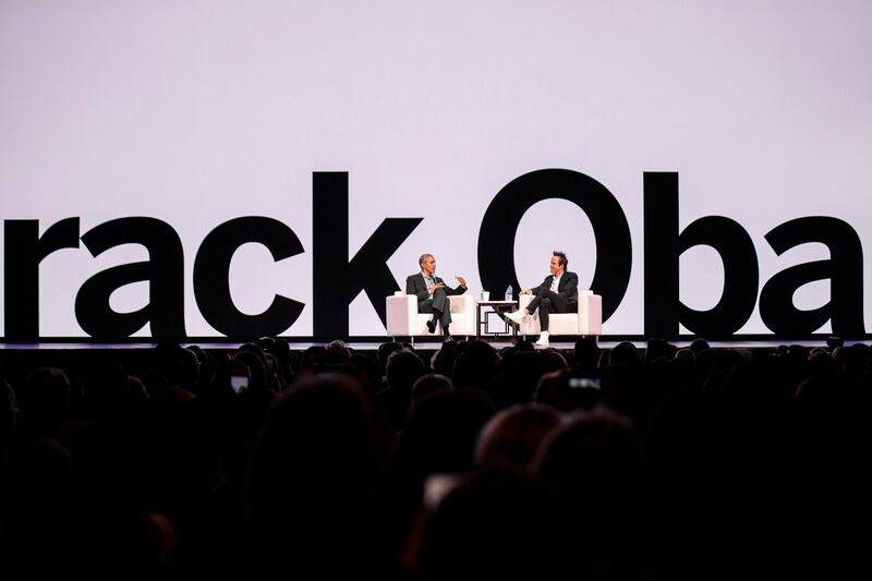 Former President Barack Obama speaks with Qualtrics co-founder and CEO Ryan Smith during the company's annual user summit at the Salt Palae Convention Center on Wednesday, March 6, 2019. About 11,000 attendees are expected this week for the event hosted b