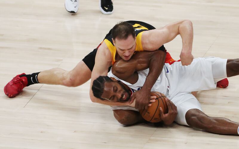 Utah Jazz’s Bojan Bogdanovic and LA Clippers’ Kawhi Leonard fight for the ball during Game 2 of their playoff series in SLC.