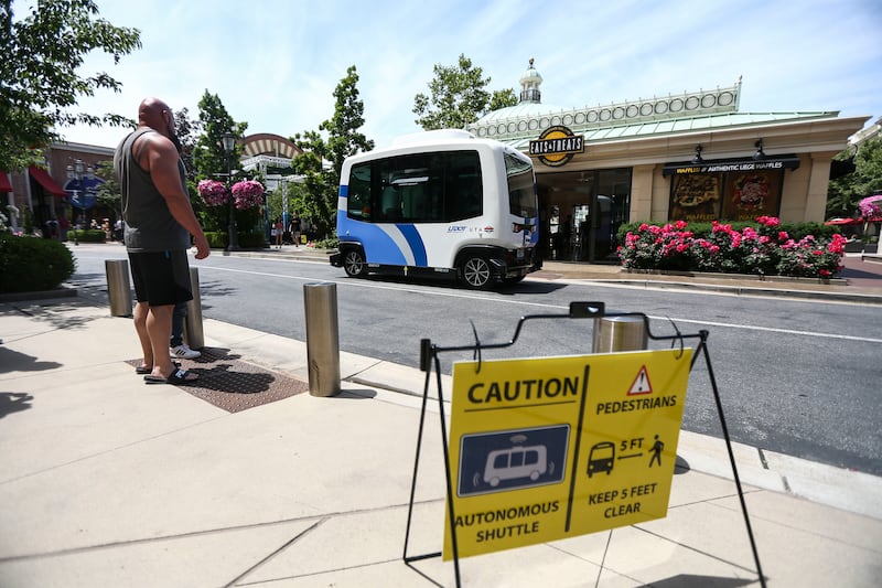 An autonomous shuttle drives around Station Park in Farmington on Monday, June 17, 2019.