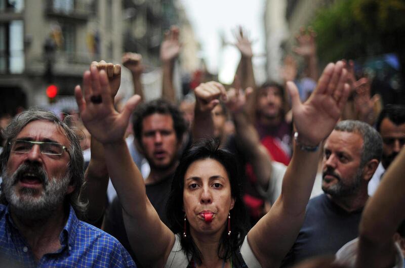 Protestors demonstrate in the center of Barcelona, Spain, Sunday, June 19, 2011. The rally, one of many nationwide protests, was held to demonstrate against Spain's economic crisis and alleged political corruption.