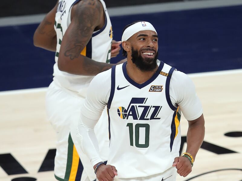 Utah Jazz guard Mike Conley smiles after dropping a 3-point shot as the Jazz and Sacramento play in Salt Lake City.