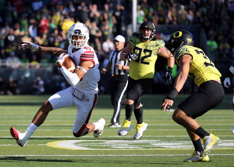 Utah Utes wide receiver Samson Nacua (45) runs with the ball during a football game against the Oregon Ducks at Autzen Stadium in Eugene, Ore., on Saturday, Oct. 28, 2017. Utah lost 20-41.
