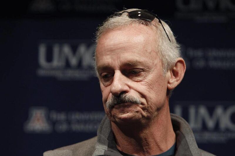 Bill Heilman, husband of injured shooting victim Susan Heilman, pauses as he describes his reaction after he found out his wife had been shot and Christina Green, 9, who was with his wife at the time had died in the shooting, during a news briefing at Uni