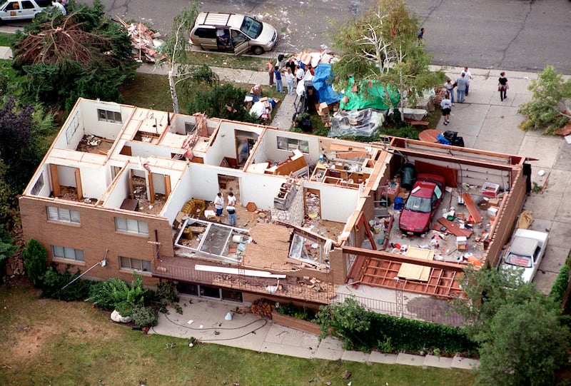 A house in the Upper Avenues neighborhood of Salt Lake City, Utah, lost its entire roof as a rare and sudden tornado swept through the city Wednesday, August 11, 1999.