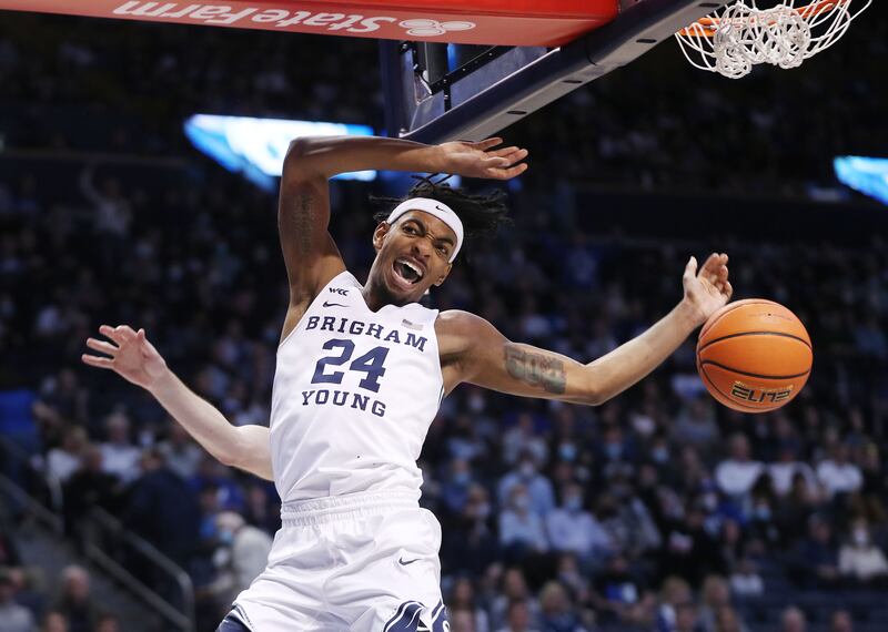 Brigham Young Cougars forward Seneca Knight dunks on the Portland Pilots.