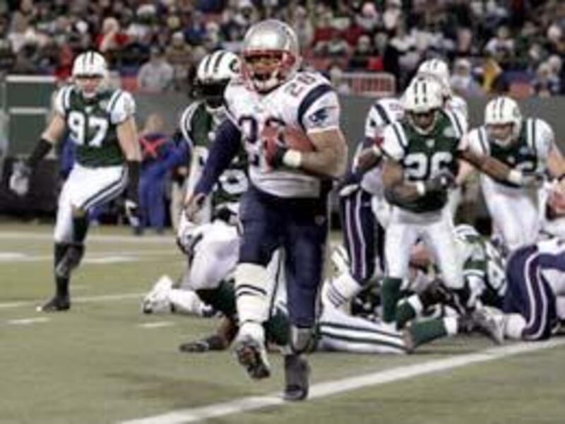 New England's Corey Dillon struts into the end zone during the second quarter of the Patriots' 31-21 Monday Night victory over the Jets.