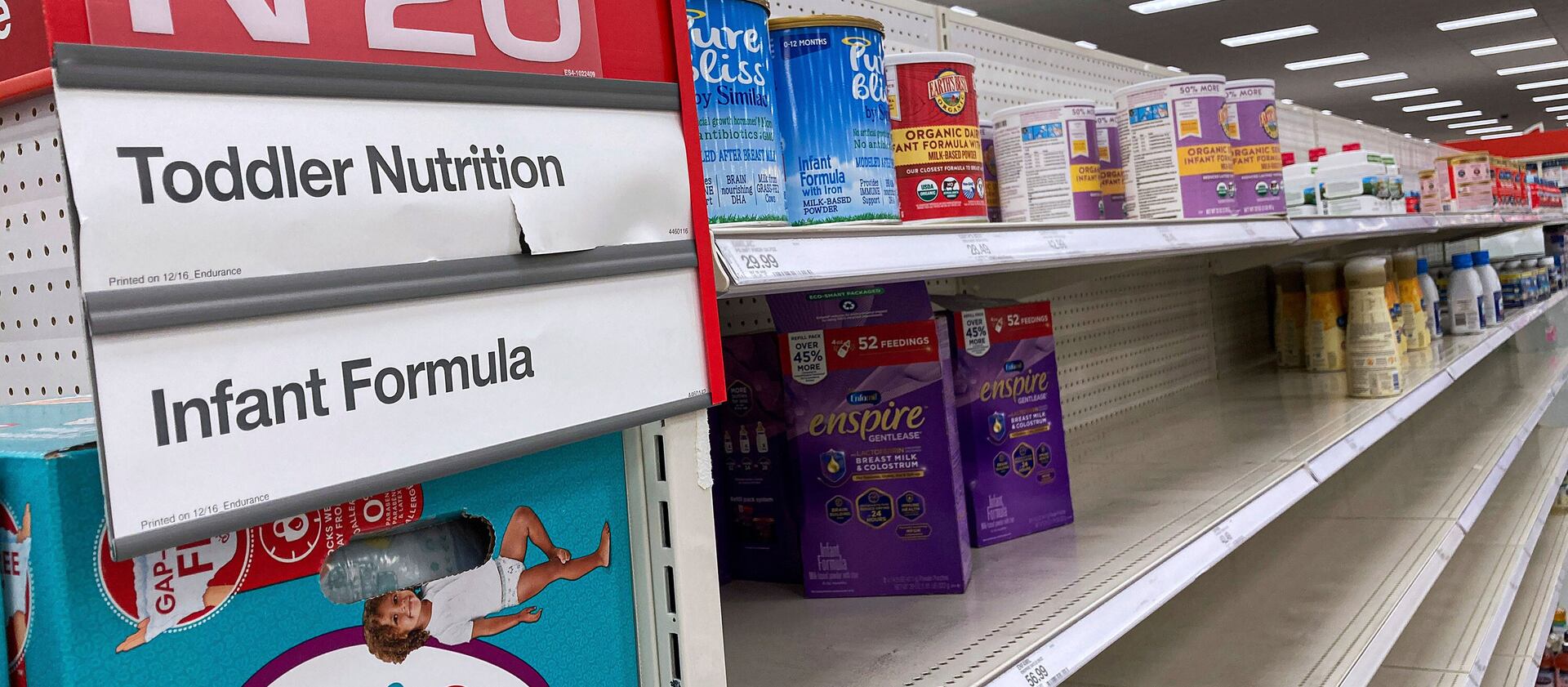 A nearly empty baby formula display shelf is seen at a Target store in Orlando.