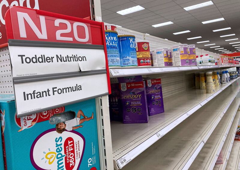 A nearly empty baby formula display shelf is seen at a Target store in Orlando.