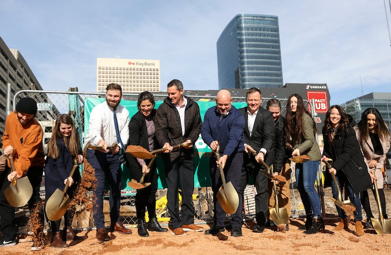 Civic and business leaders with Kensington Investment Company, HKS Architects, Jacobsen Construction Company and others pose for a photo during a groundbreaking ceremony for Astra Tower, a future 40-story building that will offer 372 luxury residences, in downtown Salt Lake City on Wednesday, Jan. 12, 2022.