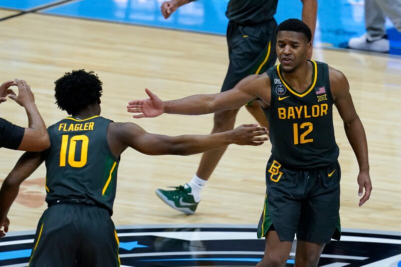 Baylor’s Jared Butler (12) celebrates with teammate Adam Flagler during Final Four game against Gonzaga at Lucas Oil Stadium.