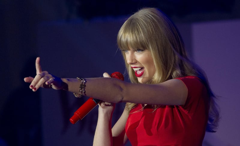 Taylor Swift performs songs from her newly released album 'Red', on stage to 10,000 fans at Westfield shopping centre in west London after switching on the centre’s Christmas lights, Tuesday, Nov. 6, 2012. (Photo by Joel Ryan/Invision/AP)