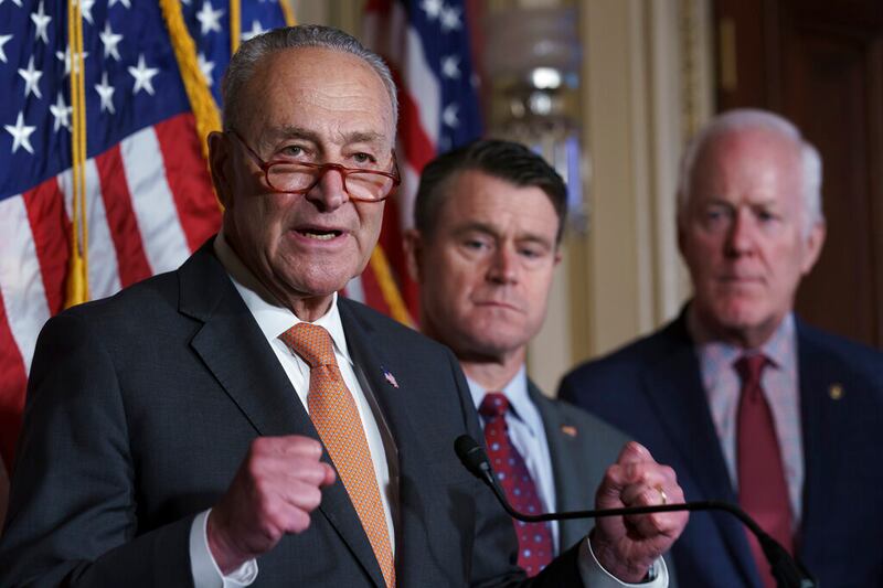 From left, Senate Majority Leader Chuck Schumer, D-N.Y., Sen. Todd Young, R-Ind., and Sen. John Cornyn, R-Texas, talk about the bipartisan effort to pass a bill designed to encourage more semiconductor companies to build chip plants in the United States, at the Capitol in Washington.