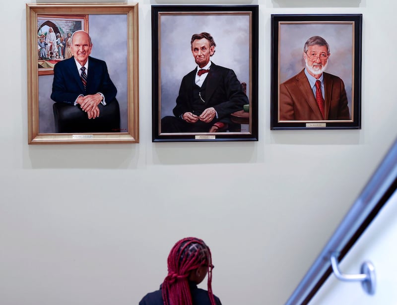 An oil portrait of President Russell M. Nelson of The Church of Jesus Christ of Latter-day Saints, left, hangs in the International Hall of Honor with President Abraham Lincoln.