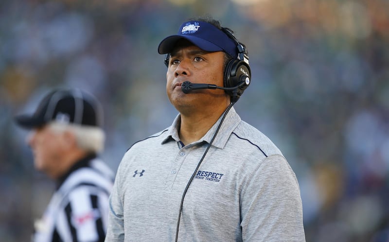 Navy head coach Ken Niumatalolo looks at the scoreboard during the second half of an NCAA college football game against Notre Dame, Saturday, Oct. 10, 2015, in South Bend, Ind. Notre Dame won the game 41-24. (AP Photo/Jeff Haynes)