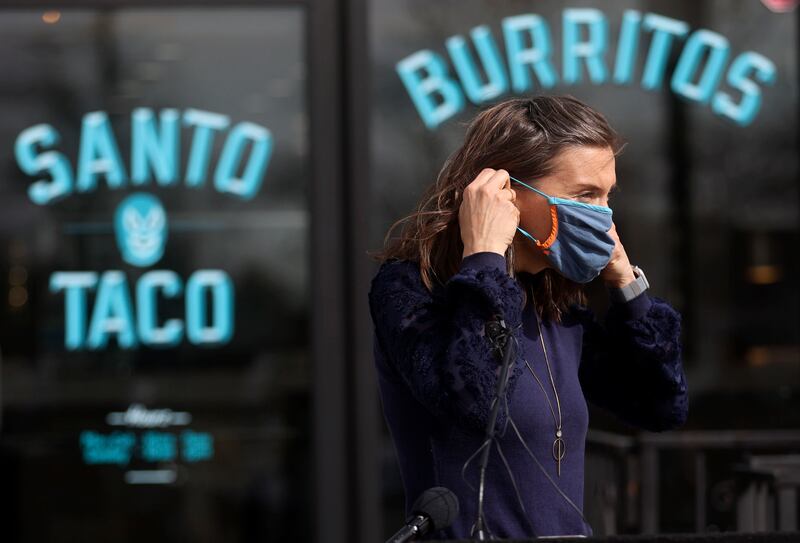Salt Lake City Mayor Erin Mendenhall puts her mask on.