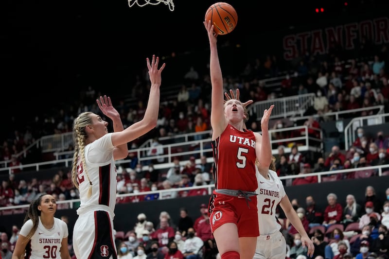 Utah guard Gianna Kneepkens (5) shoots next to Stanford forward Cameron Brink.