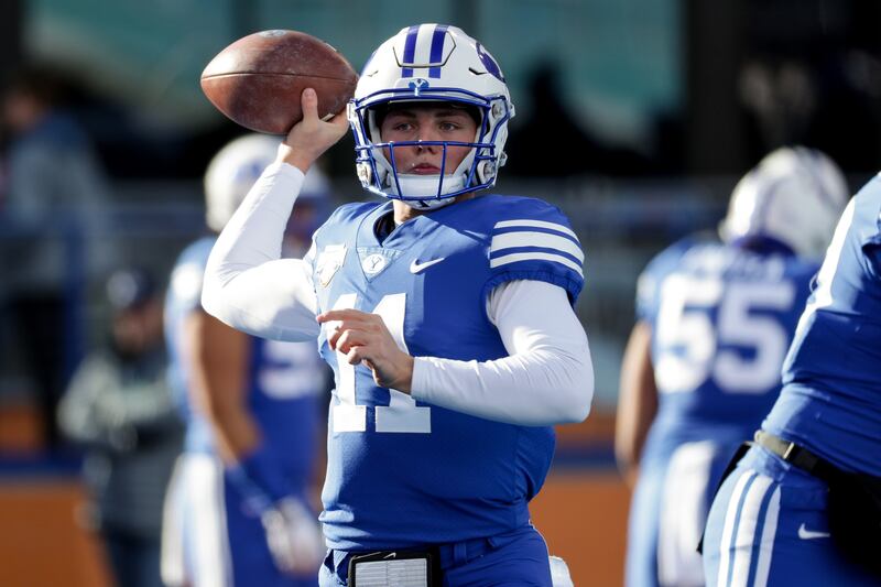Brigham Young Cougars quarterback Zach Wilson (11) warms up before playing the Western Michigan Broncos in the Famous Idaho Potato Bowl at Albertsons Stadium in Boise, Idaho on Friday, Dec. 21, 2018.