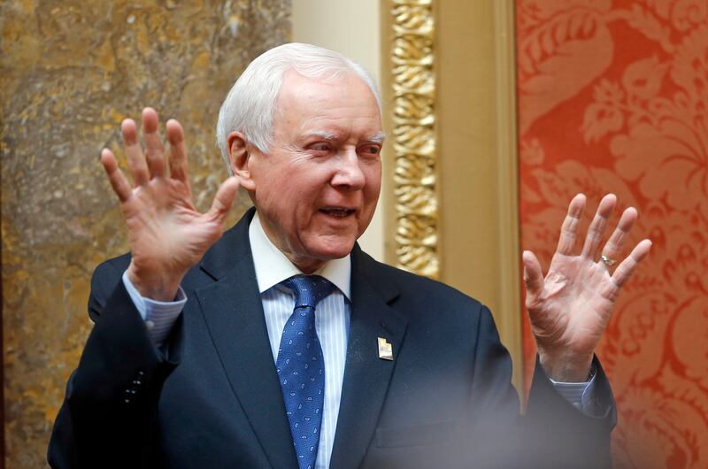 FILE - In this Feb. 21, 2018, file photo, Sen. Orrin Hatch, R-Utah, gestures to the Utah House during a visit at the Utah State Capitol, in Salt Lake City.