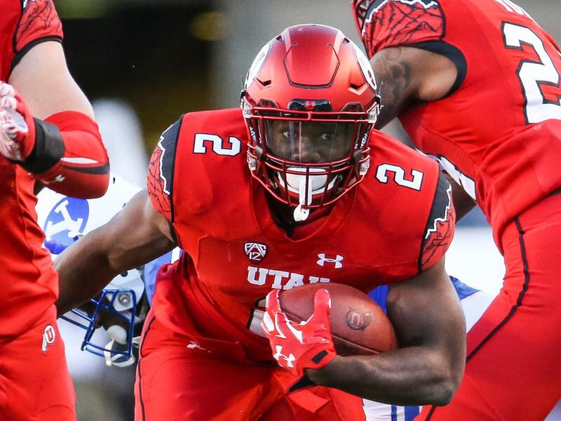 Utah’s Zack Moss looks for daylight during a game against BYU at Rice-Eccles Stadium in 2016.
