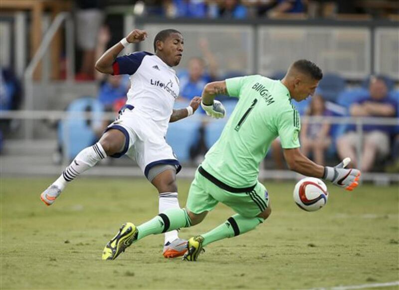 San Jose Earthquakes goalkeeper David Bingham (1) blocks a goal attempt by Real Salt Lake forward Jou Plata, left, during the second half of an MLS soccer match Sunday, Sept. 27, 2015, in San Jose, Calif. San Jose won 1-0.