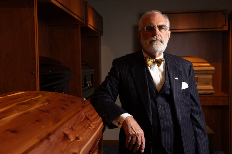 John E. Lindquist poses for a portrait at Lindquist’s Ogden Mortuary in Ogden on Dec. 11, 2023.