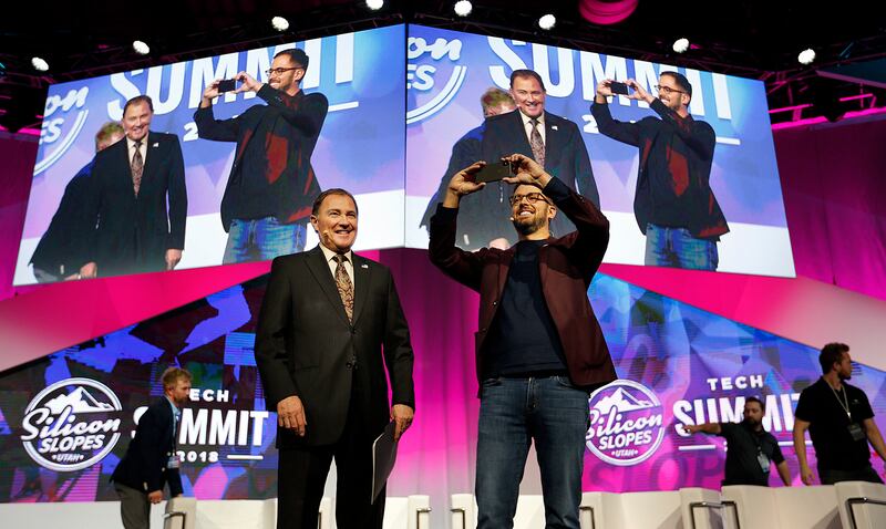 Gov. Gary Herbert, left, and Pluralsight CEO Aaron Skonnard participate in the Silicon Slopes Tech Summit at the Salt Palace in Salt Lake City on Friday, Jan. 19, 2018.