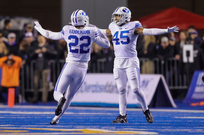 BYU’s Pepe Tanuvasa and Ammon Hannemann celebrate after Boise State turns the ball over on downs.