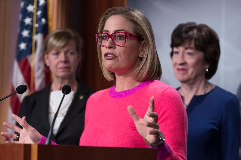 Arizona Sen. Kyrsten Sinema is shown speaking to reporters following Senate passage of the Respect for Marriage Act.