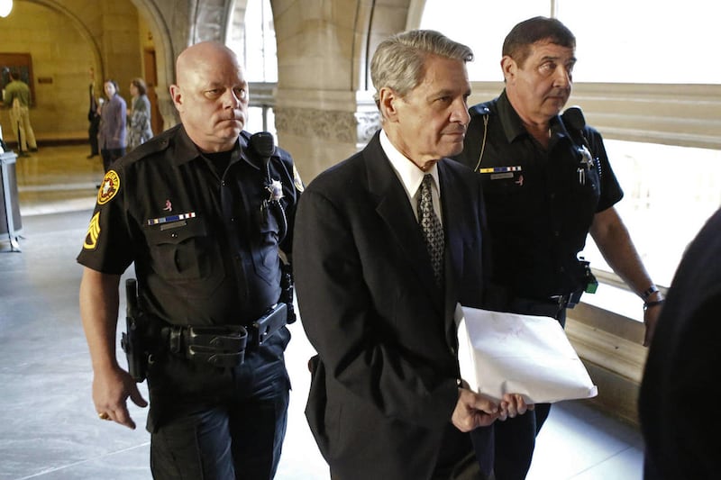 Dr. Robert Ferrante, center, is escorted by Allegheny County Sheriffs deputies to court during jury selection for his trial on homicide charges in the 2013 killing of his neurologist wife with cyanide on Thursday, Oct. 23, 2014, in Pittsburgh. Ferrante ha