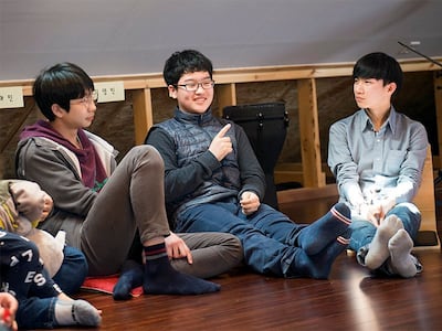 Kyung Min, center, discusses Korean reunification with his school peers at the River of Life School near Taebaek, South Korea.