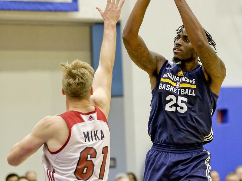 Indiana Pacers' Rakeem Christmas (25) takes a shot over Miami Heat's Eric Mika (61) during the first half of an NBA summer league basketball game, Monday, July 3, 2017, in Orlando, Fla. (AP Photo/John Raoux)