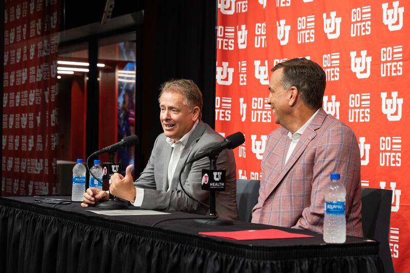 University of Utah President Taylor Randall, left, and athletic director Mark Harlan speak at a press conference regarding Utah’s move to the Big 12 Conference.